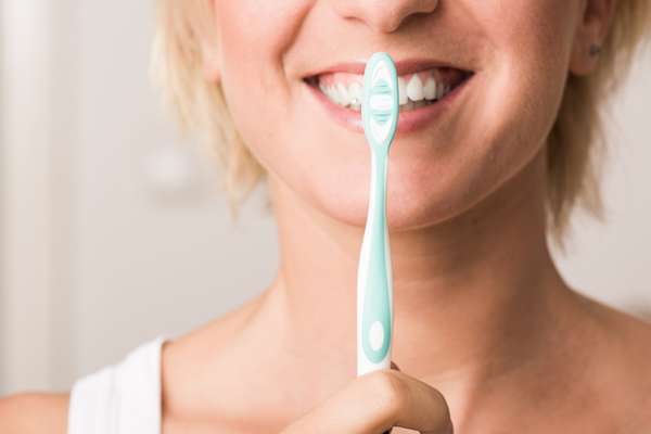 lady with toothbrush