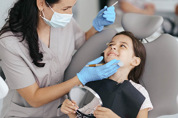 dentist with little girl